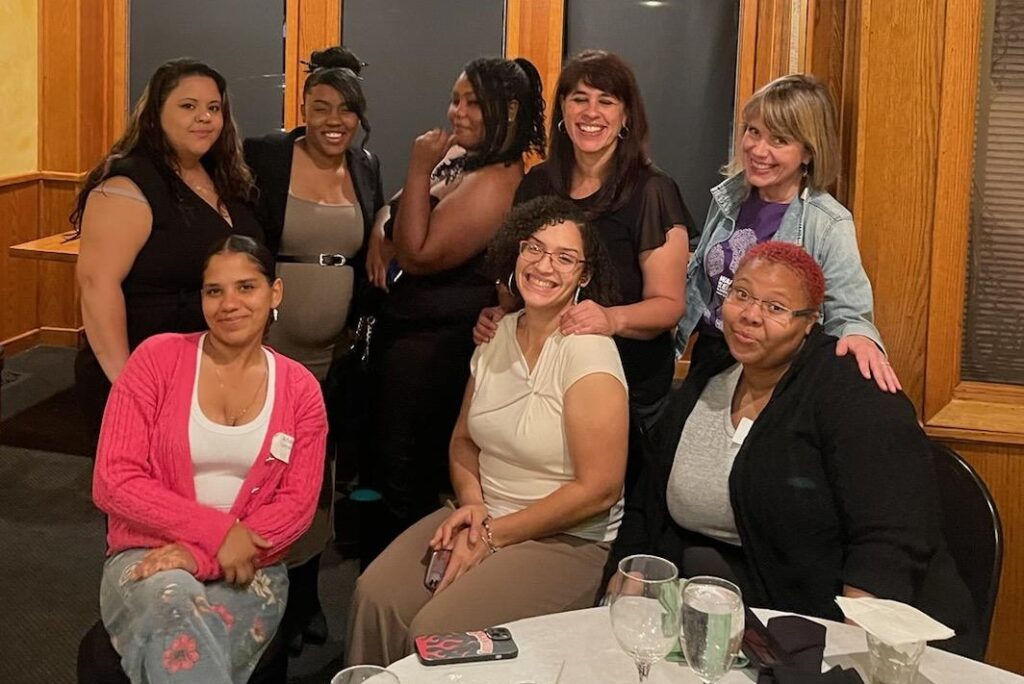 Group of women smiling in a room